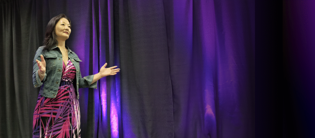 Carolyn Cummins, speaking on stage. Social Media and digital marketing speaker and coach. Small business advocate. 